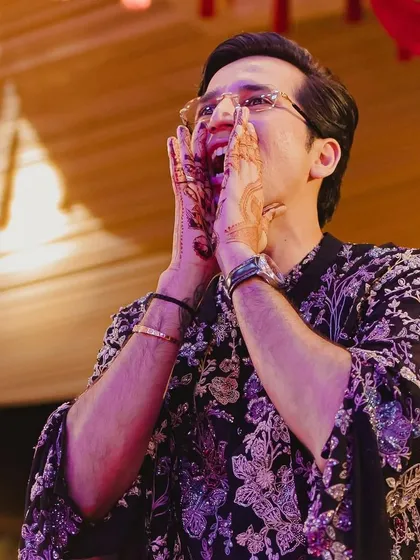 The groom's enthusiastic reaction says it all! We aim to create moments of pure, unscripted joy.