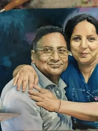 An oil portrait of a couple for a Canadian client. The soft, abstract background in shades of blue makes their figures stand out.