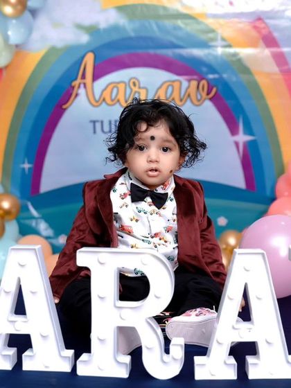 A charming 'Woodland' themed birthday party, with rustic decor, forest animal cutouts, and natural elements, creating a cozy and enchanting setting.