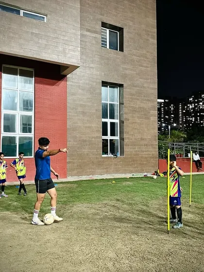 An evening training session at our Sapphire International School center, where our U13 Elite players work on technical skills under floodlights.