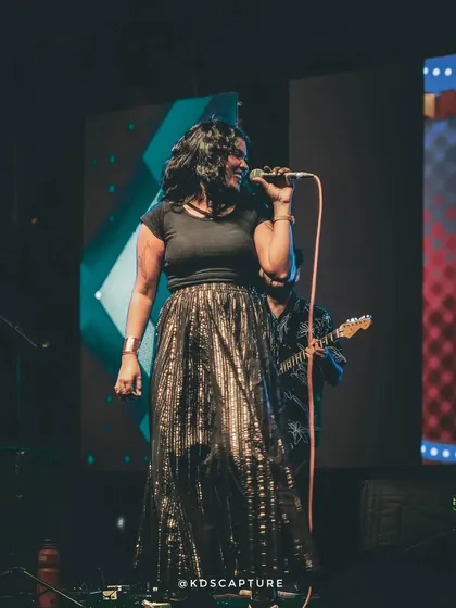 Caught in my happy place. This shot from the 'Eats & Beats' festival captures the pure joy I feel on stage. This is the vibe you can expect: all smiles, great music, and a performance full of heart.