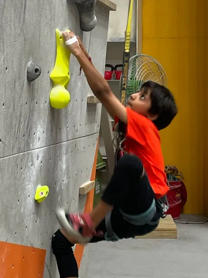 This young climber shows incredible focus and technique. Our walls have routes designed for all sizes and skill levels, so kids can progress at their own pace.