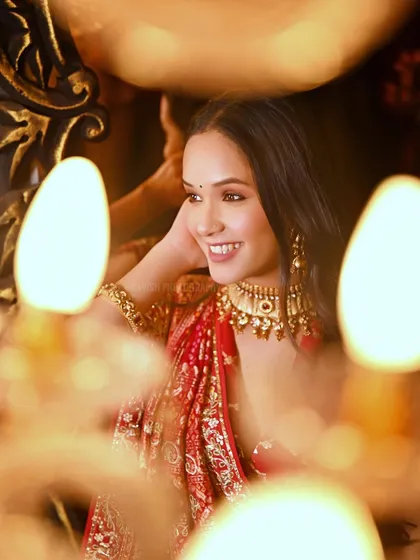 A graceful pose highlighting the subject's elegance and the warm ambiance.