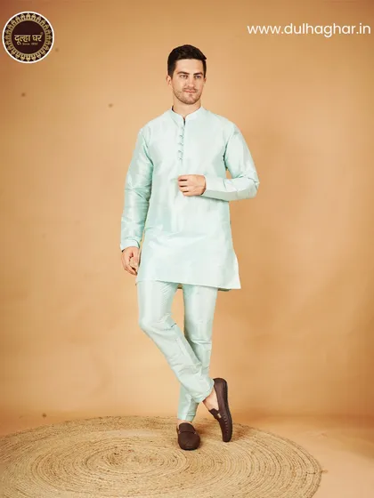A pastel green kurta pajama set, a perfect example of timeless elegance and comfort for any occasion.