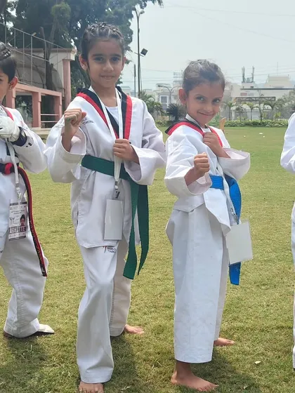Our fierce young competitors in their fighting stance, ready to represent the academy at the championship.