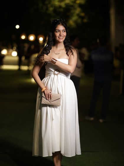 A beautiful white strapless midi dress I wore to an event. This is a classic and elegant choice that can be styled in many different ways.