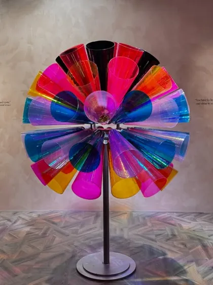 A colorful, kinetic sculpture from the 'Bad Taste?' installation. The piece is a playful and audacious object that celebrates a louder, more expressive aesthetic.