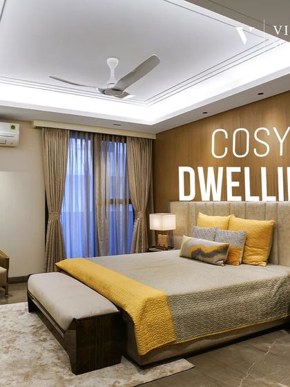 This cozy dwelling is a celebration of comfort and style. We used a warm color palette with pops of yellow, soft textures, and a wooden paneled wall to create a truly calming environment.