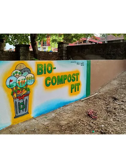 Another wide shot of the compost pit project. It shows the full length of the wall and how the artwork provides a splash of color and purpose to the area.