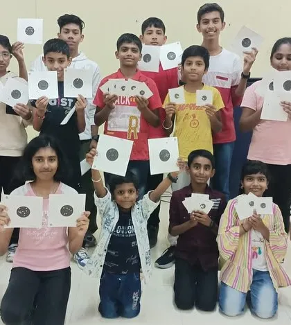 The proud result of a group shooting session for kids. It's rewarding to see them learn a new skill and show off their target practice results with a smile.