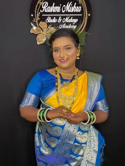 A classic portrait of the model, looking poised and elegant in her traditional Maharashtrian attire.