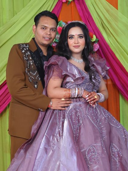 The happy couple posing for a photo at their engagement.