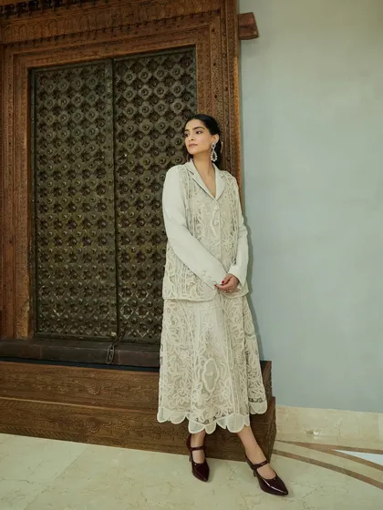 A full-length shot of Sonam Kapoor in a beautiful lace outfit from Studio Moonray, showcasing a modern take on romantic dressing.