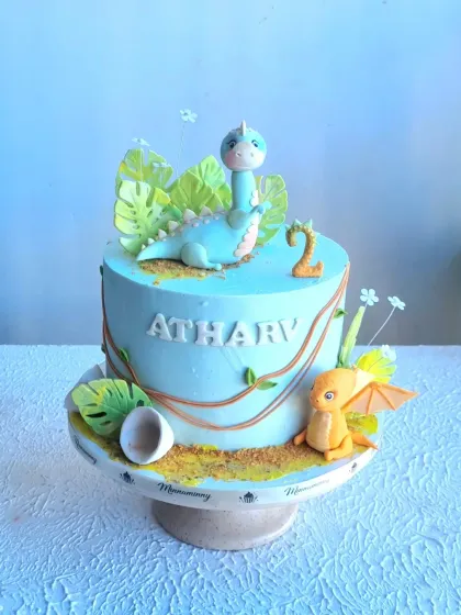 A cute dinosaur cake with hand-sculpted fondant toppers. I show how to create the dinosaur, tropical leaves, and a cracked eggshell for a complete prehistoric scene.
