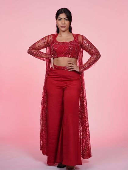 A full-length view of the red three-piece Indo-Western set, a powerful and glamorous look for any event.