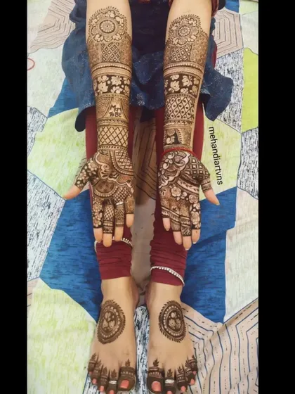 A lovely festive mehandi for Teej, with matching designs on the hands and feet. The circular 'mandala' design on the feet is a classic choice.