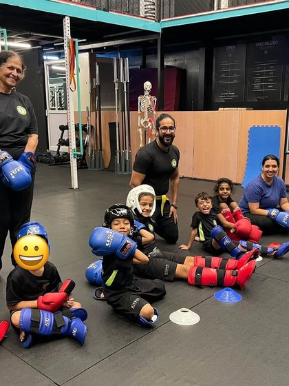 Still smiling after some tough sparring. The camaraderie and support in our classes make even the toughest drills enjoyable.
