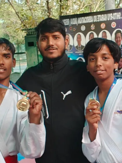 Two of our boys proudly showing off their gold medals after a tough district level competition.