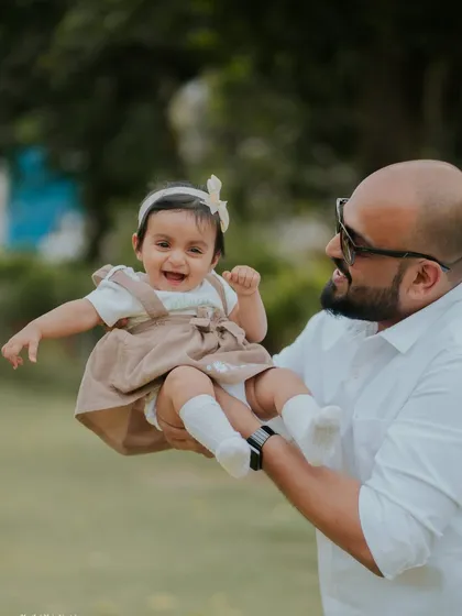 These are the moments that matter most. A father's joy as he plays with his daughter during her first birthday outdoor session. I always make sure to capture these precious family connections.