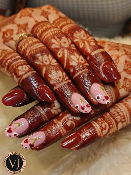 We teach you to create designs that respect tradition while feeling modern. This look, pairing hand-painted floral art with intricate mehndi, is a favorite for bridal and festive seasons.