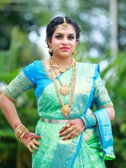 Another pose from Kavya's photoshoot, showing her confidence and the elegance of the complete look.