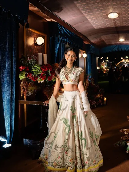 A guest enjoying the immersive "Golden Rails" experience. The decor provided a stunning and unique backdrop for photos.