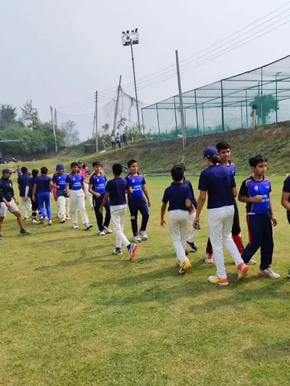 A display of sportsmanship as teams shake hands after a competitive match.