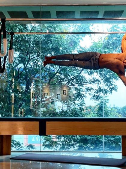 The Cadillac human flag. This is an ultimate test of oblique and upper body strength, showcasing the peak of physical control.