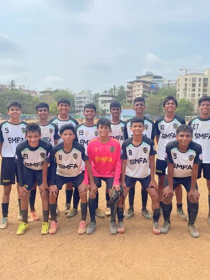 A team photo of one of our youth squads with their coach. Unity and determination are at the core of our training.