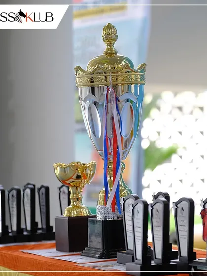 The spoils of victory. A close-up of the impressive trophies and awards waiting for the top performers at our Chess Carnival, a symbol of the excellence we celebrate.
