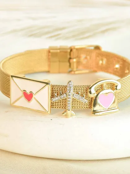 Long distance love, sorted. This personalized charm bracelet with a love letter, airplane, and telephone is the perfect gift for someone far away. It's a sweet reminder that you're always connected.