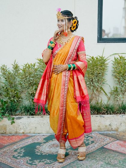 A graceful pose in the Nauvari saree, highlighting the flow and elegance of the traditional drape.