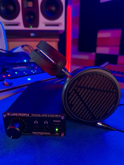 My critical listening setup. The Audeze MM-500 planar magnetic headphones, powered by a clean Lake People G103 MKII amp, are my tools for surgical mixing. They are brutally honest and reveal every flaw, ensuring that a mix translates perfectly everywhere, from a club system to earbuds.