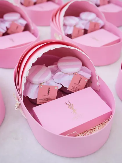 Welcoming a new life is a precious moment. Our custom baby announcement hampers, like these adorable pink cradle boxes, are a whimsical and sweet way to share your happy news.