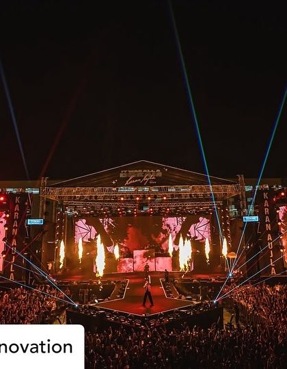 A powerful shot of Karan Aujla on a custom-built stage extension, bringing him closer to the thousands of fans.