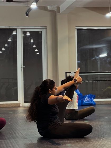 Our contemporary and jazz classes also focus on building a strong, flexible body. Here, a student works on her extensions during a floor exercise.