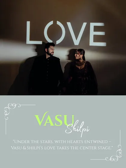 A creative shot of Vasu and Shilpi with the word 'LOVE' projected behind them. This image sets a cinematic tone for their reception, highlighting their love as the main event.