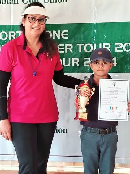 Taanush Kumar receives his winner's trophy at the IGU Sub-Junior & Junior Feeder Tour in Haryana.