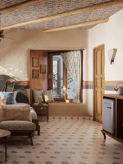 This image showcases a different guest room layout, featuring a cozy window nook and patterned floor tiles. The woven ceiling and wooden furniture maintain the resort's signature earthy and handcrafted aesthetic.