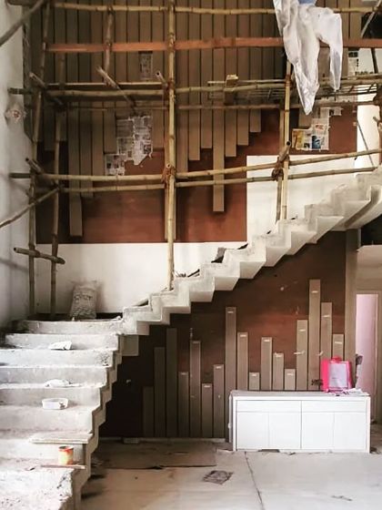 The staircase area during the early construction phase of the Nagpur bungalow. This raw view shows the structural foundation upon which we layer our interior finishes to achieve the final polished look.
