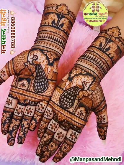 A beautiful example of traditional Indian mehndi, showcasing majestic peacocks on the palms. The dark, rich stain highlights the fine lines and detailed patterns that extend up the forearms, perfect for any bride who loves classic motifs.