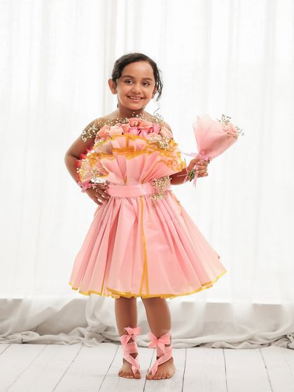 Dressed like a beautiful bouquet, this seven-year-old is ready for her birthday photoshoot. We work with you to coordinate outfits and props for a cohesive look.