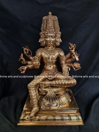 A bronze sculpture of Lord Brahma, the creator god and part of the Hindu Trimurti. His four heads, representing the four Vedas, are sculpted with serene expressions.