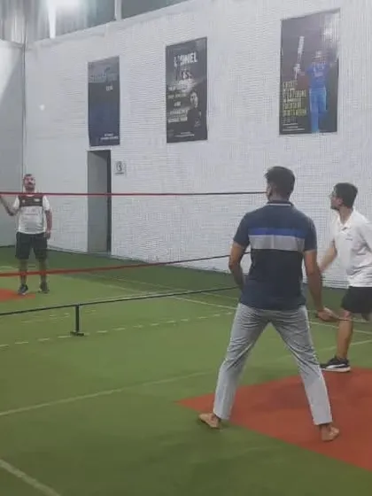 Hustle, hit, and never quit. A doubles team working together to keep the shuttle in play.