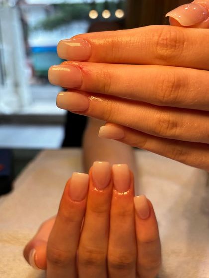 Another view of the beautiful French Ombré nails, showing the flawless, milky gradient that makes this style so popular.