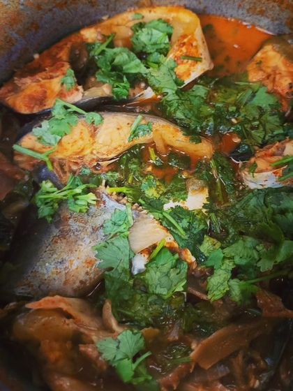 A pot of my Naga style Pangasius Fish curry simmering with bamboo shoots. The fresh coriander on top adds a burst of freshness to this tangy and spicy fish dish.