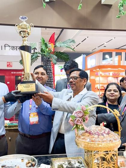 Our team proudly holding the trophy at the World Mithai Namkeen Convention & Expo. This award motivates us to keep innovating.