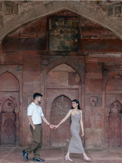 Leading the way through history. This shot at a heritage site in Delhi captures a sense of journey and togetherness, framed by the beautiful rustic textures of the past.