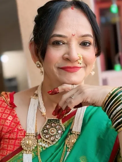 A beautiful portrait showcasing the traditional jewellery and the soft, glowing makeup.