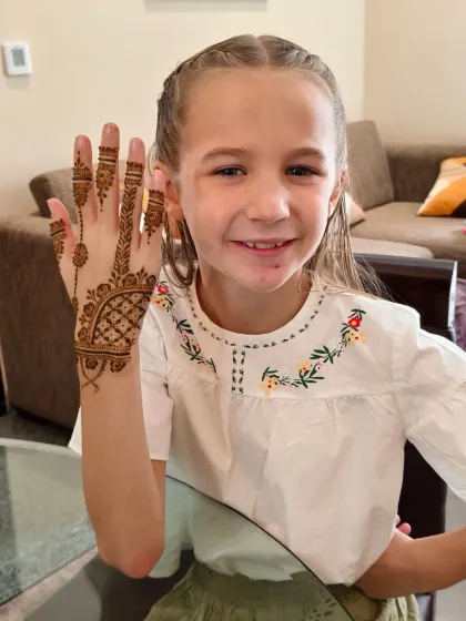 Her sister was just as thrilled with her matching henna design.